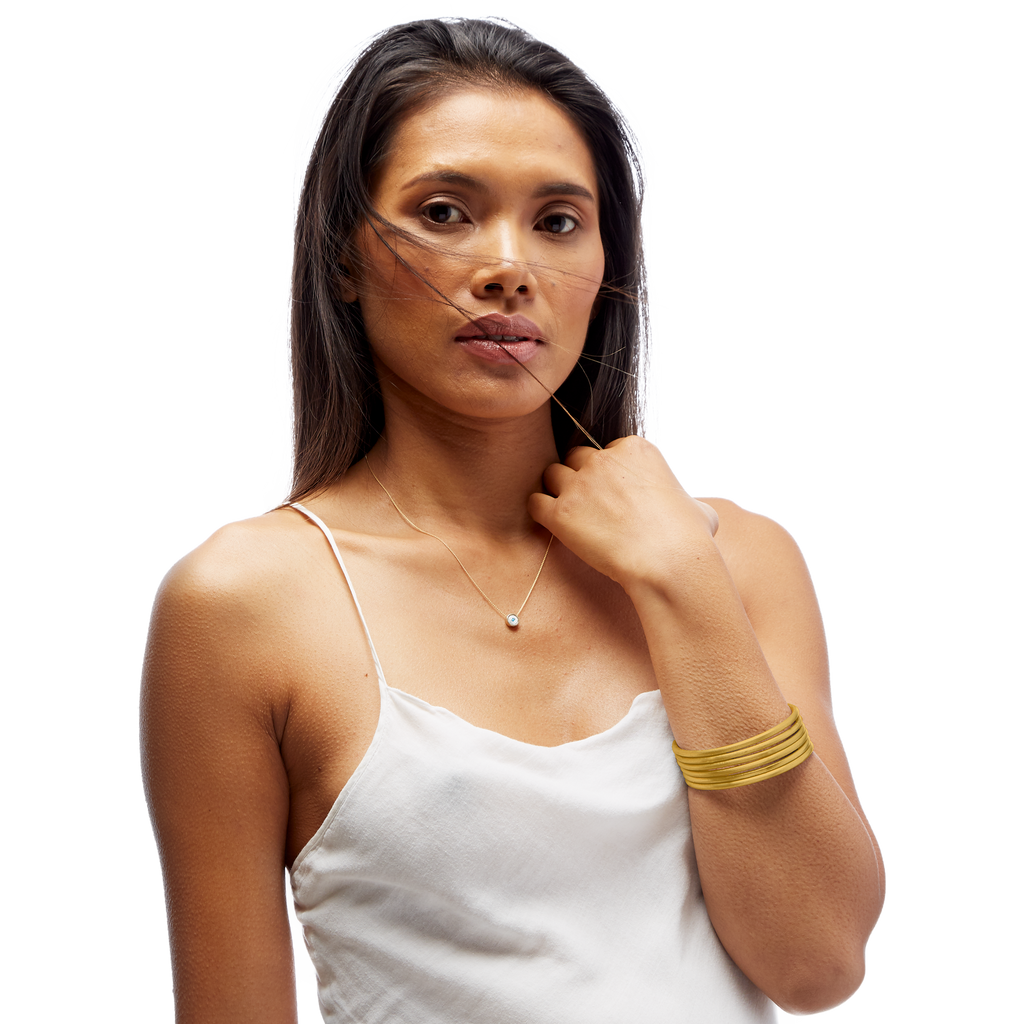 VIRTUOUS CIRCLE GOLD TONE SKINNY BANGLE