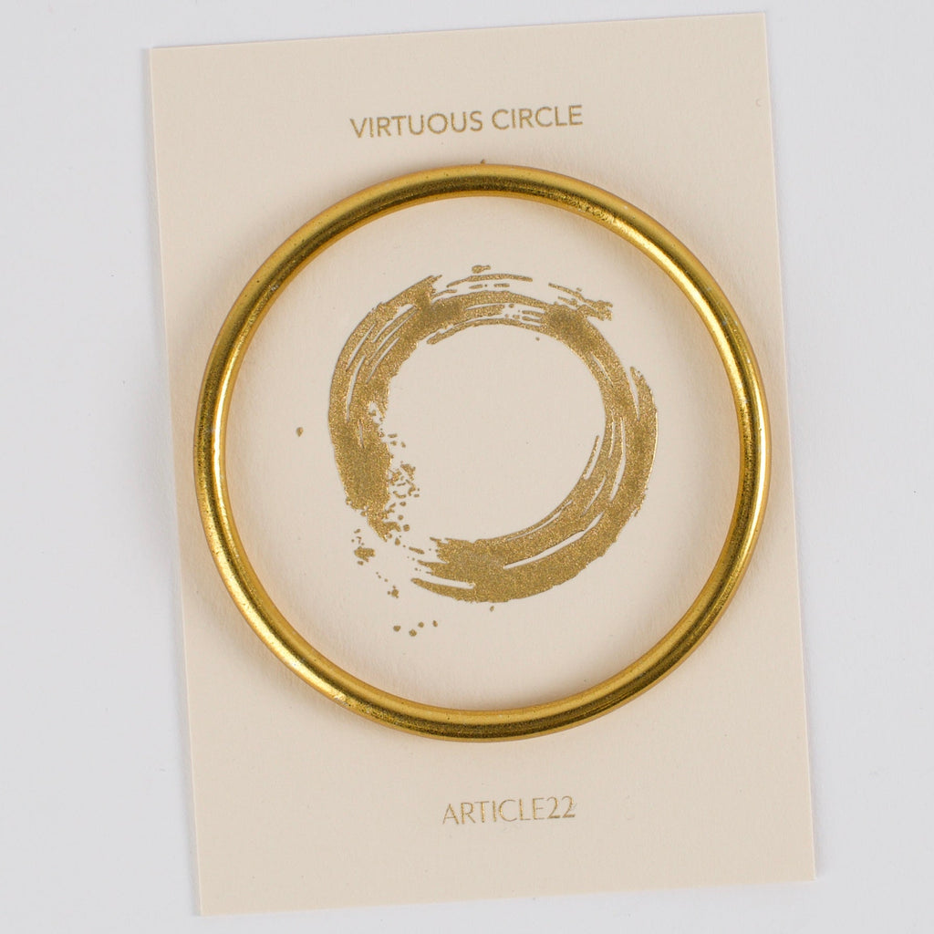 VIRTUOUS CIRCLE GOLD TONE SKINNY BANGLE