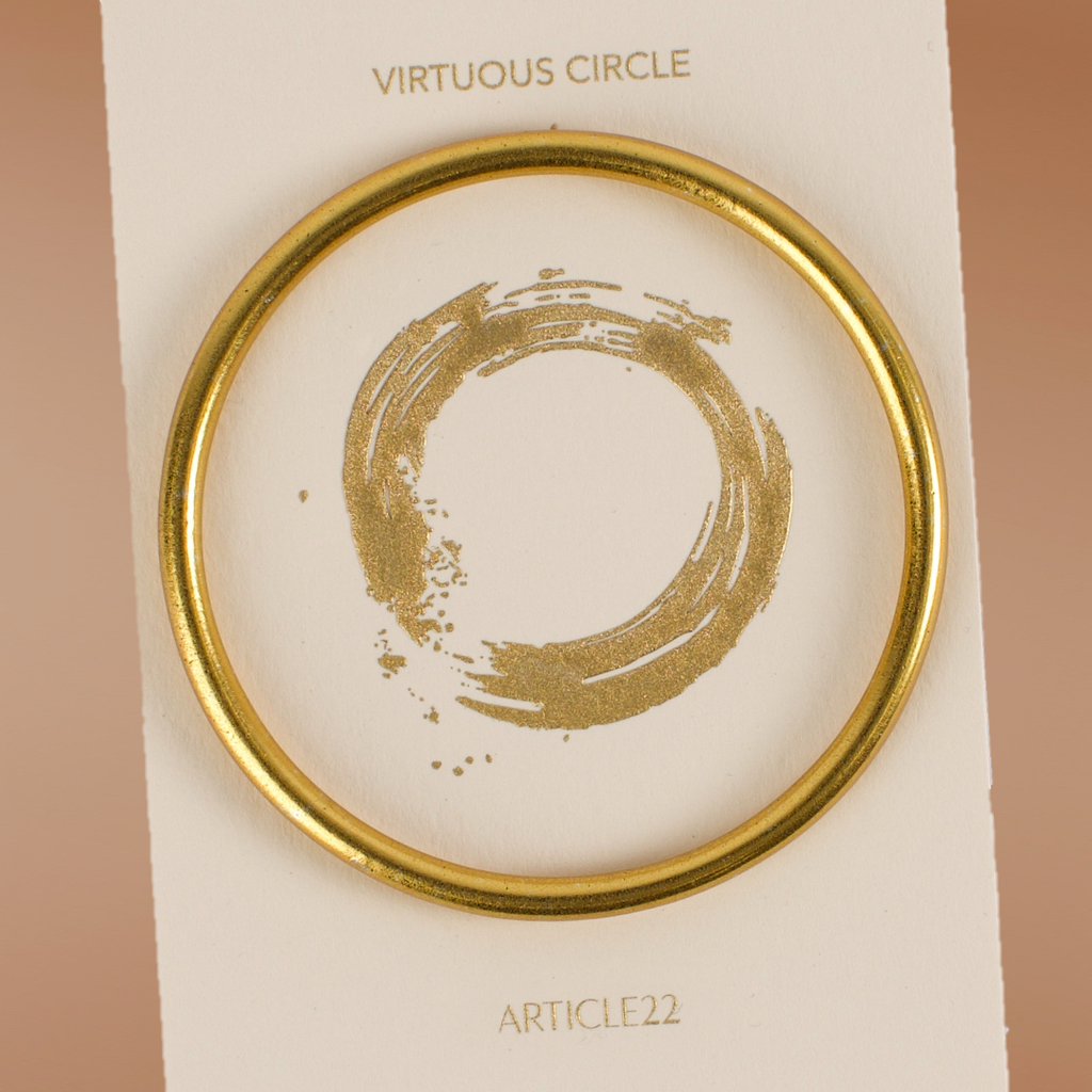 VIRTUOUS CIRCLE GOLD TONE SKINNY BANGLE