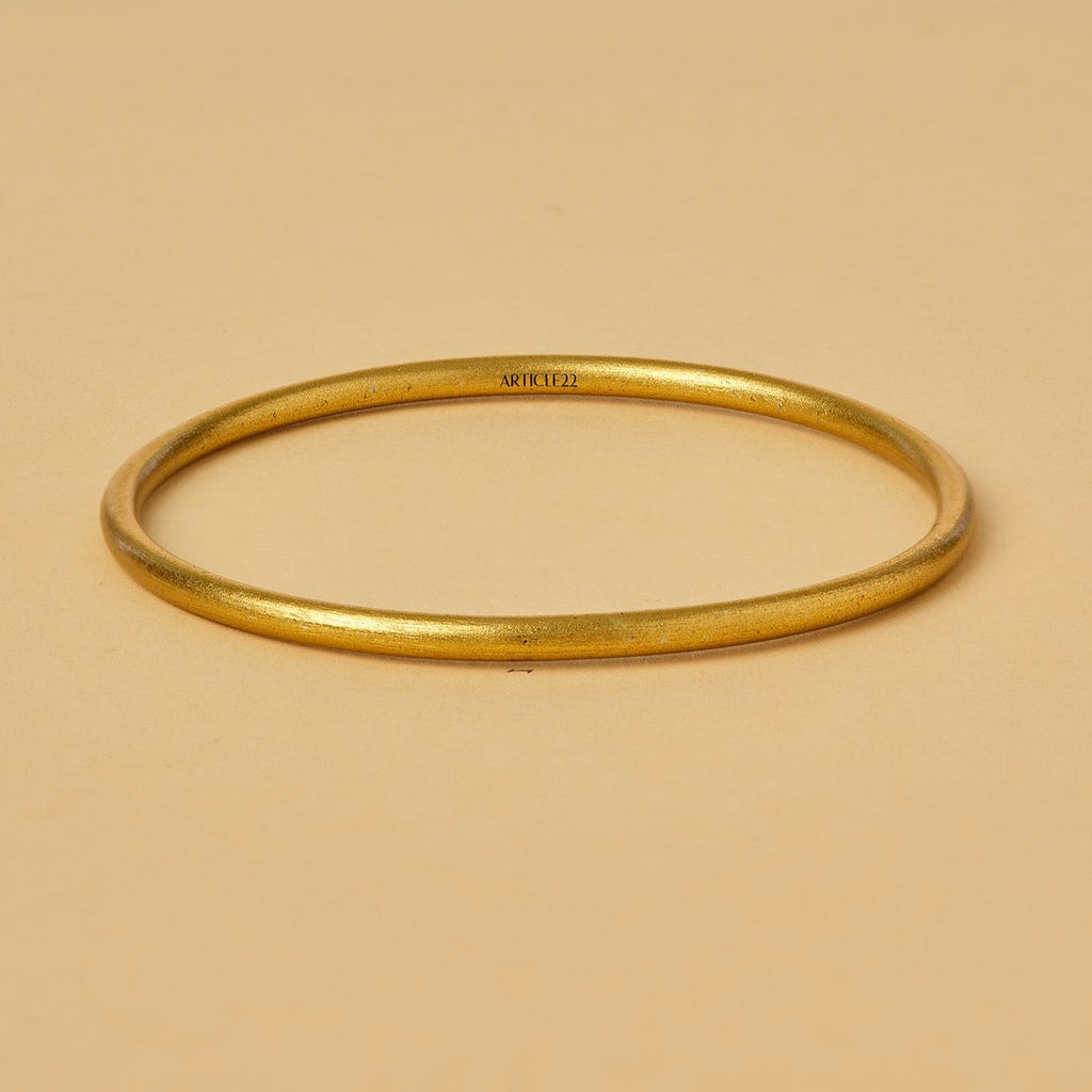 VIRTUOUS CIRCLE GOLD TONE SKINNY BANGLE
